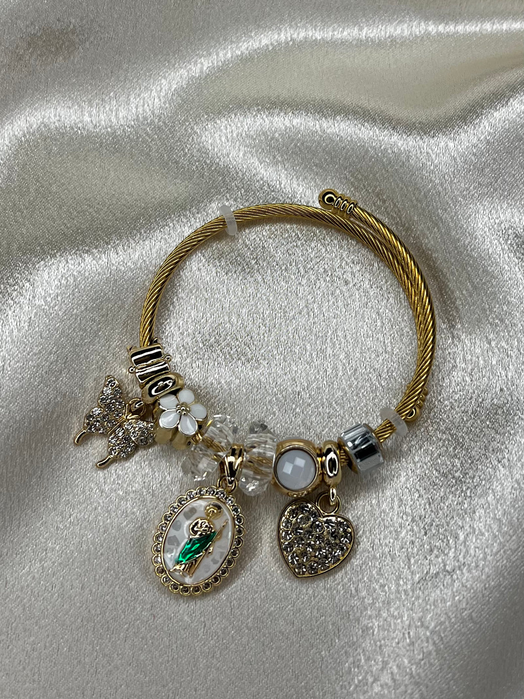 white & gold san judas charm bracelet